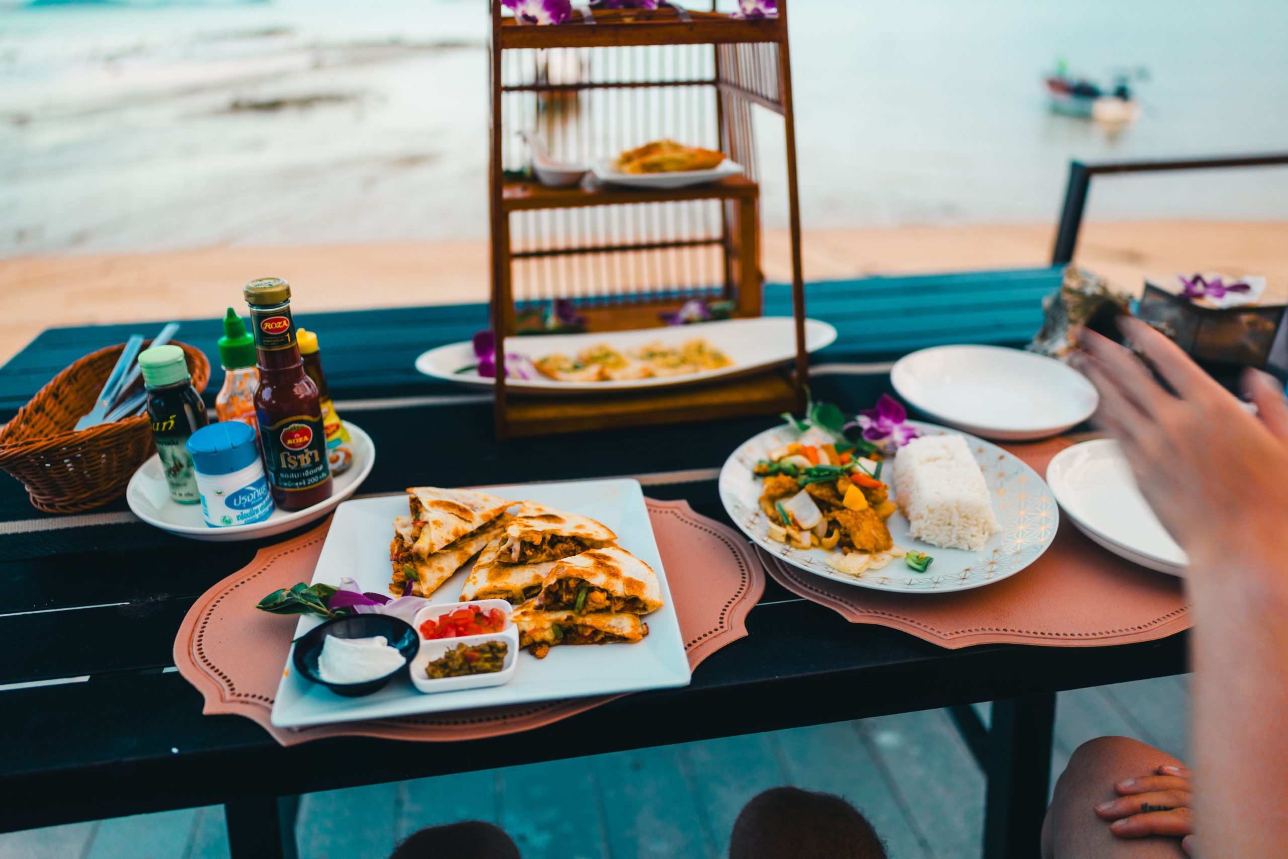 Enjoy a diverse Thai meal by the ocean with stunning views of Phuket, Thailand.